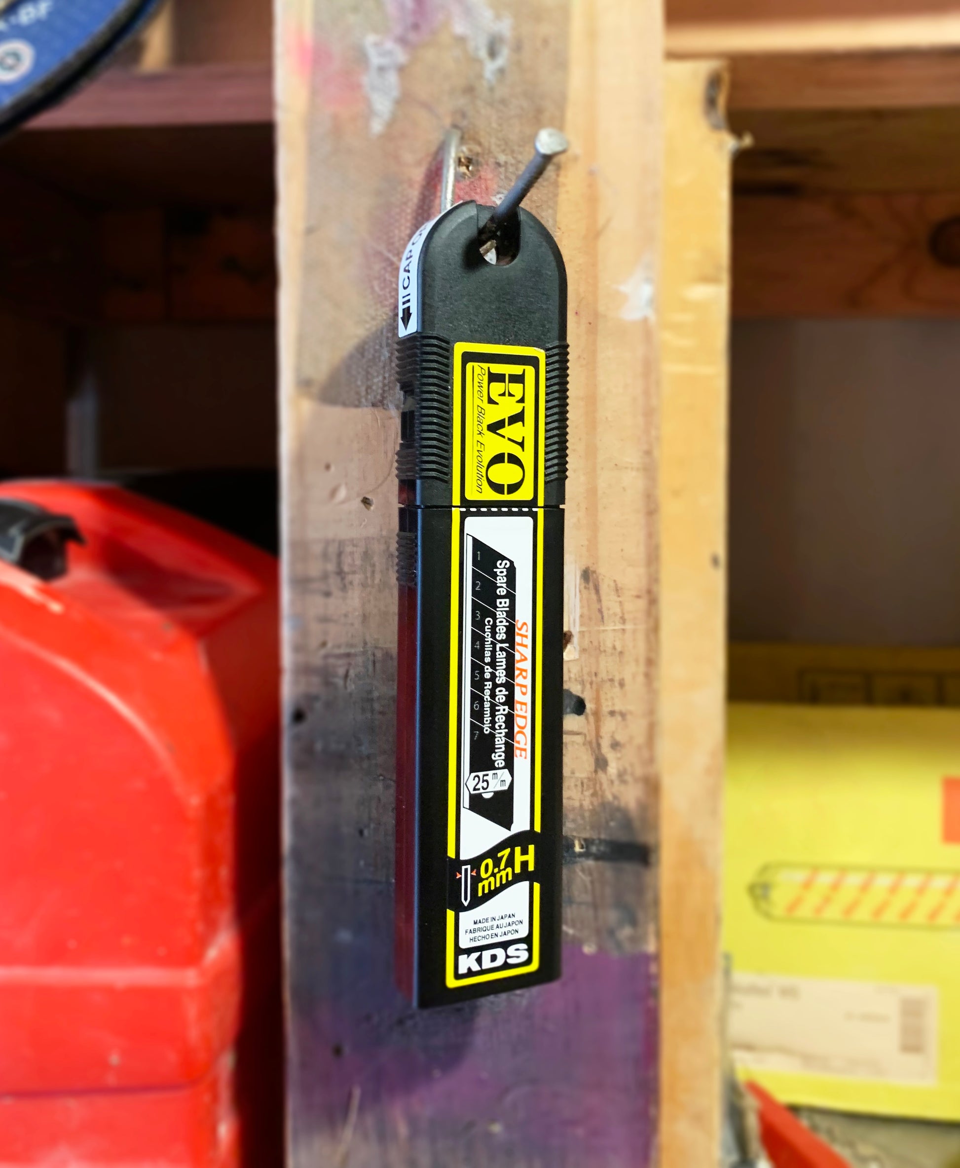 Tradegear Online's KDS 25mm Black Blades in storage case hanging on nail.
