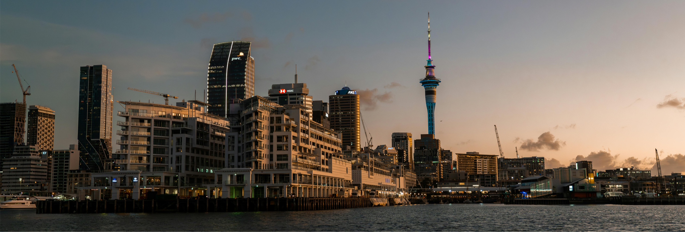 Auckland skyline with modern buildings and cranes showing construction all around